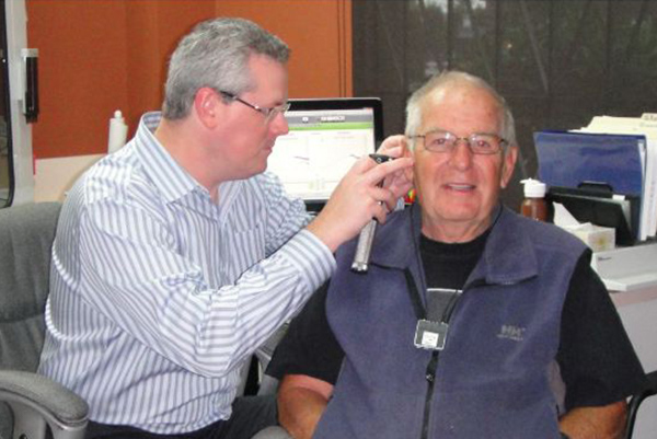 Mike March conducting a hearing test - Boardwalk Hearing
