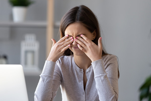 Woman rubbing her eyes because they are dry and irritated – Dry eye clinic – Meibomian gland disease – Keratitis – Blocked oil glands expression - Boardwalk